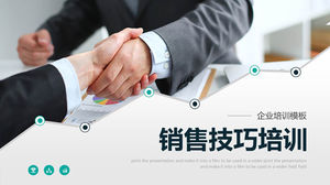 PPT-Vorlage für das Training von Verkaufskompetenzen mit Handshake-Zeichenhintergrund