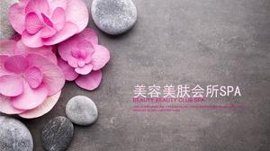 美丽健康ppt模板上粉红色的花朵鹅卵石背景