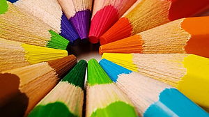 PPT background picture of colored pencils in a circle
