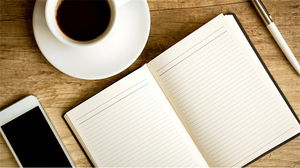 Obraz w tle PPT drewnianego pulpitu notatnika filiżanki kawy